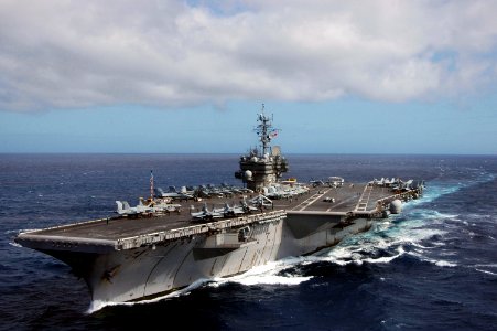 US Navy 060818-N-6106R-208 The conventionally-powered aircraft carrier USS Kitty Hawk (CV 63) turns into the wind to conduct cyclic flight operations while operating off the coast of Australia