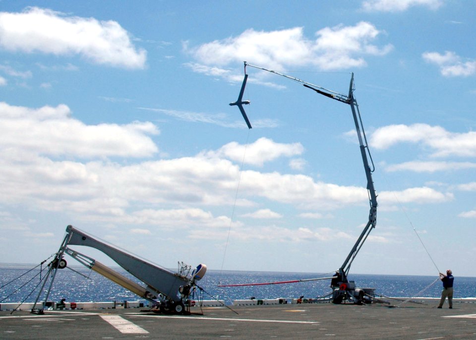 US Navy 060818-N-8547M-001 An Unmanned Aerial Vehicle (UAV) Scan Eagle lands in the skyhook for recovery on the flight deck aboard the amphibious assault ship USS Saipan (LHA 2)