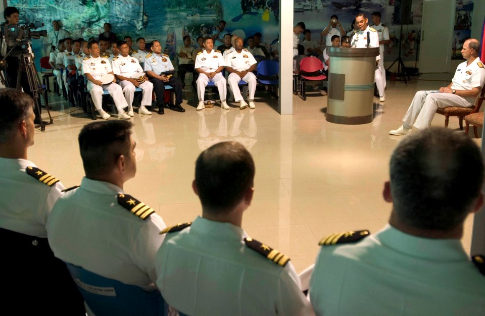 US Navy 060815-N-9851B-005 Commander, Task Force Seven Three (CTG-73) Rear Adm. William Burke, right, looks on as Commander Philippine Fleet, Rear Adm. George T Uy, addresses U.S. and Philippine Navy participants of (CARAT) dur