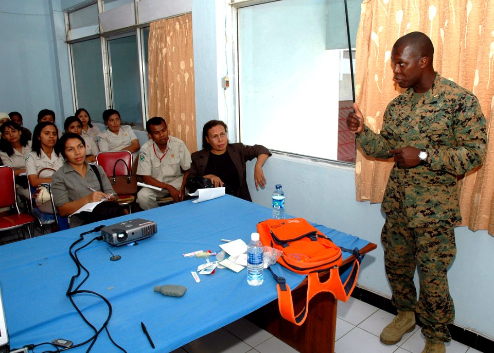 US Navy 060821-N-3931M-122 Navy Lt. Johnfritz Antoine with the Medical Treatment Facility aboard the Military Sealift Command hospital ship USNS Mercy (T-AH 19) instructs a training session on medical cleanliness and hygiene