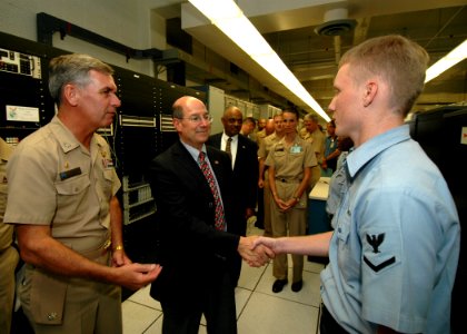 US Navy 060822-N-4965F-002 Secretary of the Navy (SECNAV), the Honorable Dr. Donald C. Winter, greets Information Systems Technician 3rd Class Brent Jackson from Oakdale, Calif., during a visit to Naval Computer and Telecommuni