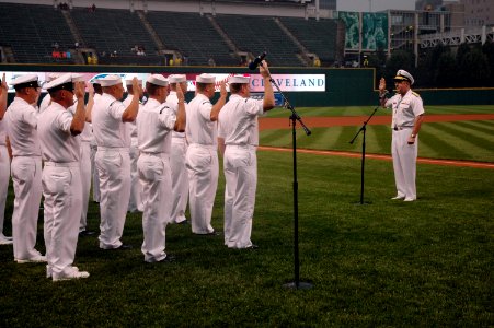 US Navy 060828-N-1805P-014 Chief of Naval Personnel Vice Adm. John C. Harvey Jr. administers the oath of office while reenlisting 15 members of Navy Operational Support Center (NOSC) Cleveland photo