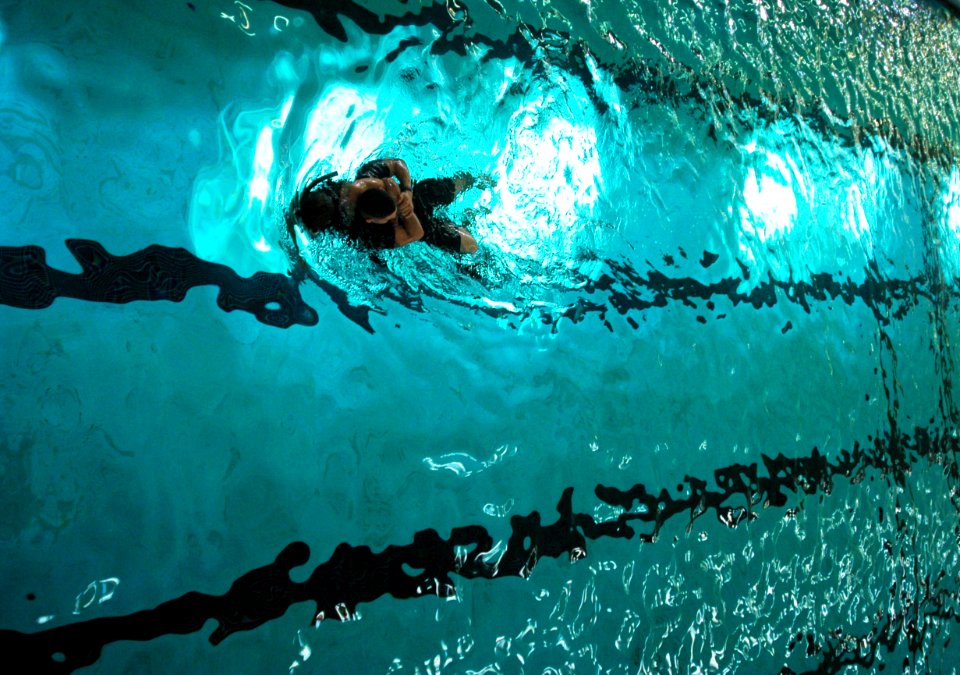 US Navy 060823-N-5484G-035 Aviation Boatswain's Mate Airman Eric Alcala from Fort Lauderdale, Fla., represents USS Bonhomme Richard (LHD 6) in a 700-meter search and rescue swim race