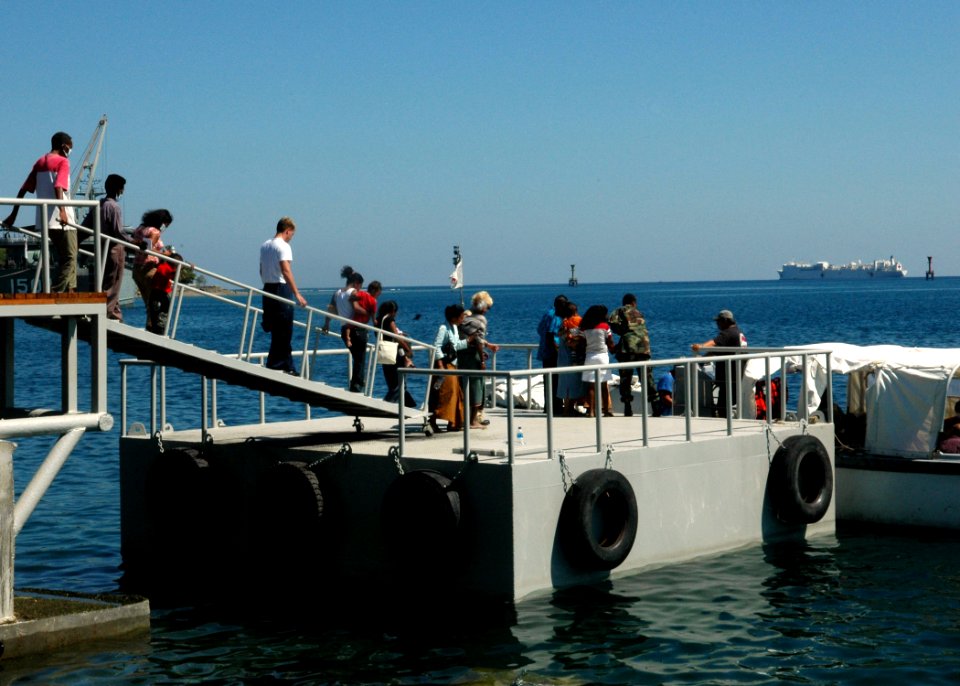 US Navy 060828-N-3714J-050 Members of the Medical Treatment Facility aboard the Military Sealift Command hospital ship USNS Mercy (T-AH 19), escort patients to a small-boat that will transport them to the ship for treatment