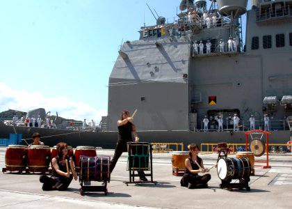 US Navy 060829-N-1332Y-069 A group of Japanese nationals perform taiko, Japanese for great drum, during a welcoming ceremony for the crew of the guided-missile cruiser USS Shiloh (DDG 67)
