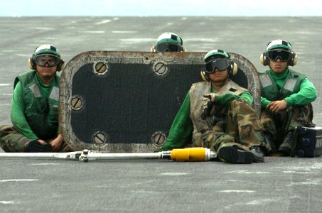 US Navy 060824-N-8604L-240 USS Kitty Hawk (CV 63) Flight deck personnel watch as a C-2A Greyhound assigned to Fleet Logistics Support Squadron Three Zero (VRC-30) prepare for launch on the flight deck