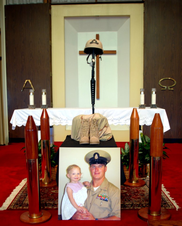 US Navy 060829-N-5555T-001 A commemorative photo sits in the Little Creek Amphibious Base Chapel honoring Chief Explosive Ordnance Disposal Technician Paul J. Darga at a memorial service given to his wife and family by Explosiv