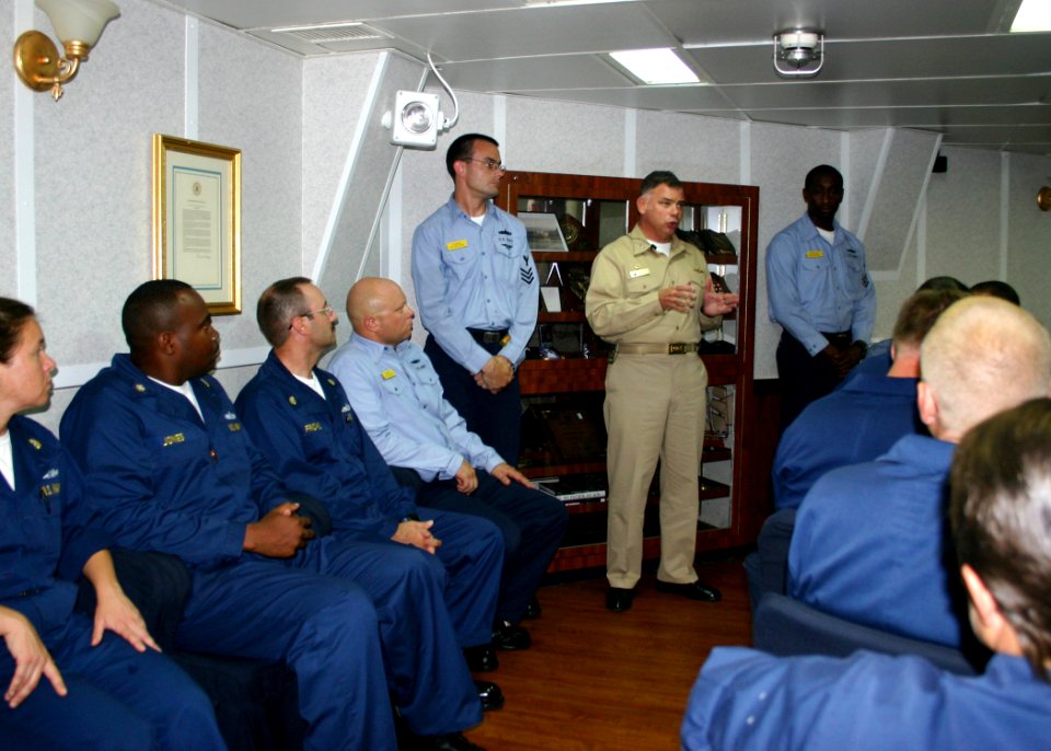 US Navy 060825-N-2893B-002 Commander, Task Force Bravo, Capt. John Nowell, discusses maritime Joint Task Force (JTF) issues with crew members aboard the destroyer USS Barry (DDG 52). JTF Lebanon assumed responsibility for U.S