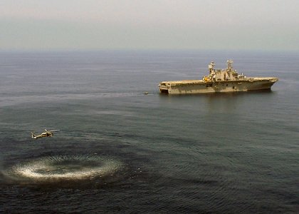 US Navy 060824-N-8547M-039 An MH-60S Seahawk assigned to Helicopter Sea Combat Support Squadron Two Six (HSC-26), hoists a search and rescue swimmer (SAR) out of the water