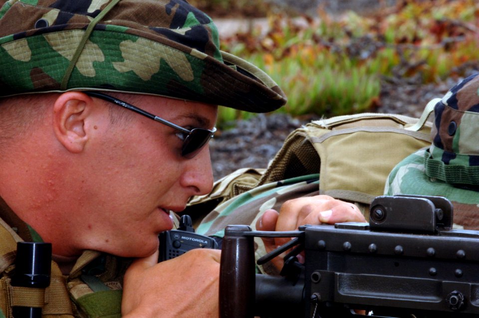 US Navy 060829-N-9818V-047 Master-at-Arms 2nd Class Bradley Wolfe assigned to Mobile Security Squadron Three (MSS-3), Detachment 33, mans a .50-caliber machine gun