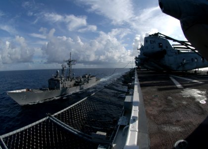 US Navy 060822-N-1467R-021 The amphibious assault ship USS Bataan (LHD 5) conducts a fueling at sea (FAS) with the guided-missile frigate USS Underwood (FFG 36)