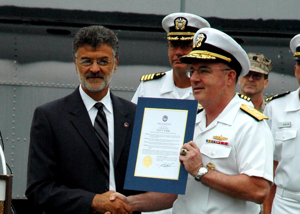 US Navy 060828-N-1805P-002 Chief of Naval Personnel, Vice Adm. John C. Harvey Jr. receives a certificate proclaiming Aug. 28 through Sept. 4, 2006, as Cleveland Navy Week, from Mayor Frank G. Jackson