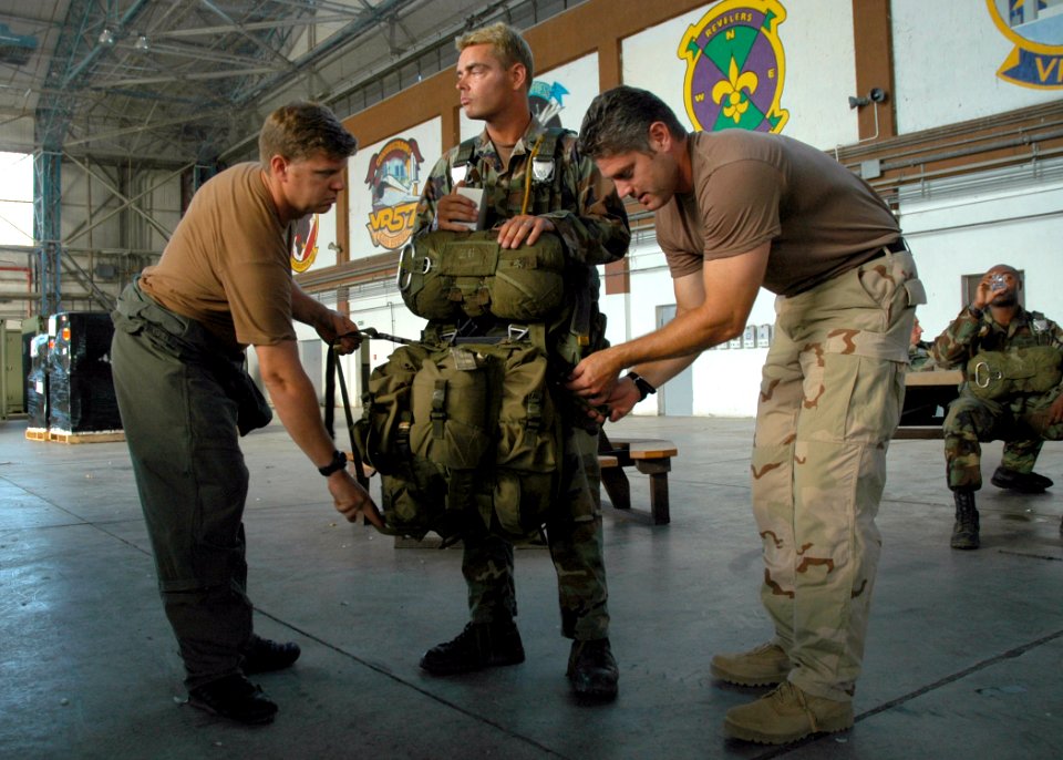US Navy 060828-N-0577G-003 Aircrew Survival Equipmentman 1st Class Gregory Kufchak, left, and Chief Aircrew Survival Equipmentman Nathaniel S. Spencer, both assigned to Explosive Ordnance Mobile Unit Eight (EODMU-8), conduct a