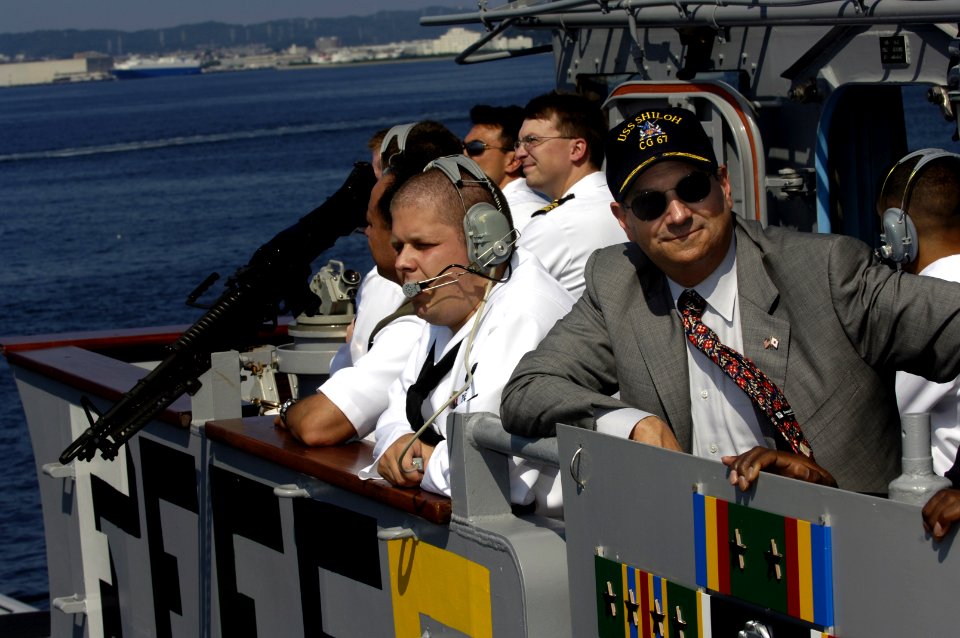 US Navy 060829-N-3642E-004 Secretary of the Navy (SECNAV), the Honorable Dr. Donald C. Winter observes the guided-missile cruiser USS Shiloh (CG 67) during her sea and anchor detail from the ship's port bridge-wing