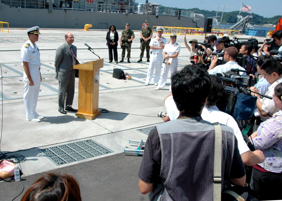 US Navy 060829-N-1332Y-320 Secretary of the Navy, the Honorable Dr. Donald C. Winter, answers questions from Japanese media shortly after arriving at Commander, Fleet Activities, Yokosuka