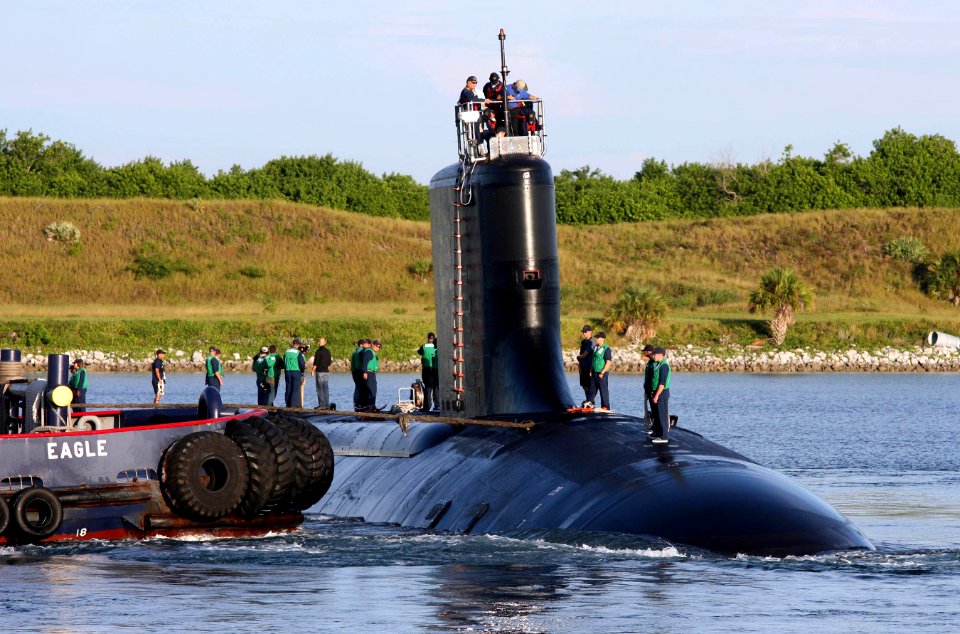 US Navy 060825-N-7441H-006 The Virginia-class attack submarine USS Texas (SSN 775) is guided into port by local tugboats near Port Canaveral