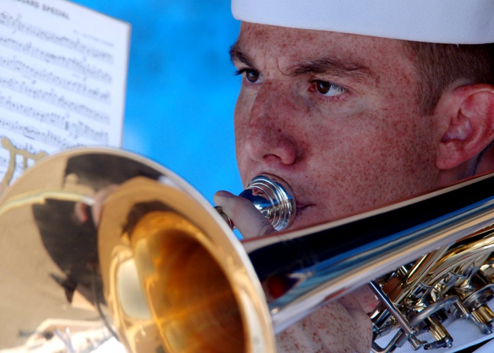 US Navy 060829-N-1332Y-010 Musician 3rd Class Matthew Anderson, assigned to the 7th Fleet Navy Band, plays the trombone during a welcoming ceremony for the crew of the guided-missile cruiser USS Shiloh (CG 67)