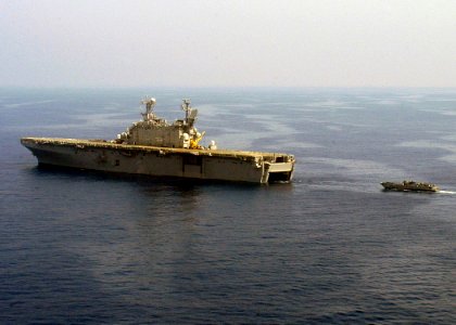US Navy 060824-N-8547M-101 Landing Craft Utility One Six Five Eight (LCU 1658) assigned to Assault Craft Unit Two (ACU-2) prepares to enter the well deck aboard the amphibious assault ship USS Saipan (LHA 2) photo