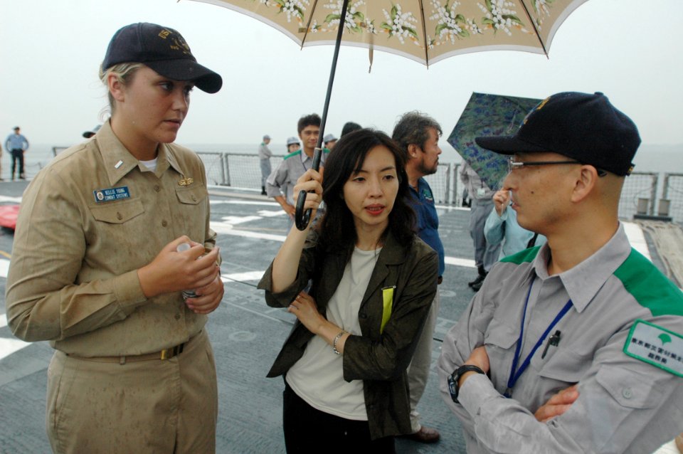 US Navy 060901-N-1332Y-366 The frigate Public Affairs Officer for the U.S. Navy frigate USS Gary (FFG 51), Lt. j.g. Kellie Young speaks with a Japanese government employee participating in a Tokyo Metropolitan Government Disast