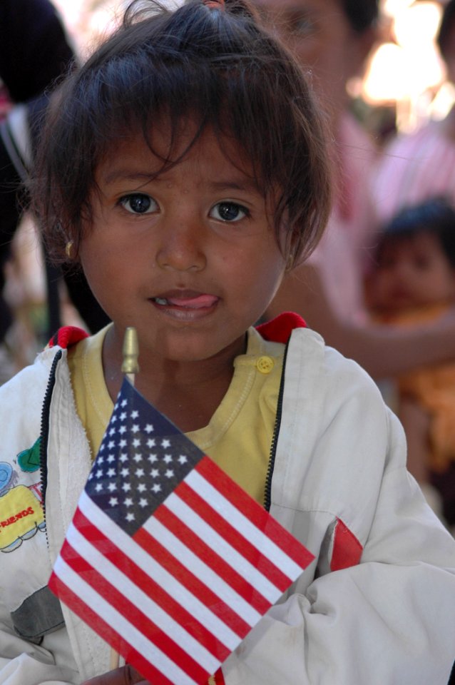US Navy 060824-N-9076B-301 A small girl proudly holds a souvenir of her visit to a medical outreach project at the Batakte Health Center as part of the Military Sealift Command hospital ship USNS Mercy (T-AH 19) visit