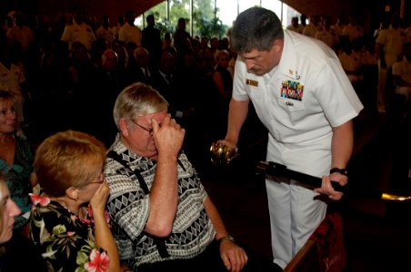 US Navy 060829-N-5555T-007 Chief Explosive Ordnance Disposal Technician Paul J. Darga's father receives a chief petty officer's ceremonial cutlass in honor of his late son photo