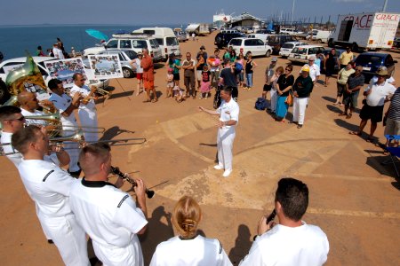 US Navy 060903-N-6501M-012 Chief Musician Don Chilton conducts the U.S. Navy Show Band against the back drop of the Military Sealift Command hospital ship USNS Mercy (T-AH 19)