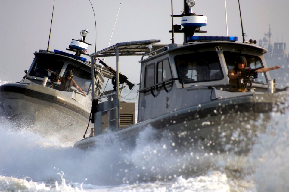 US Navy 060825-N-5555T-010 Naval Expeditionary Combat Command members perform High Value Asset (HVA) escort training between Inshore Boat Units (IBU) 41 and 42 assigned to Naval Coastal Warfare Squadron Four