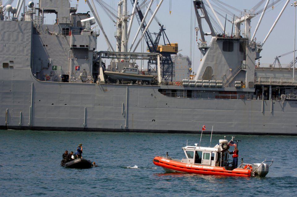 US Navy 060829-N-9818V-087 U.S. Coast Guardsmen assigned to Maritime Safety Security Team (MSST) 91103, use the Integrated Anti-Swimmer equipment with divers in the water during Exercise Seahawk 2006