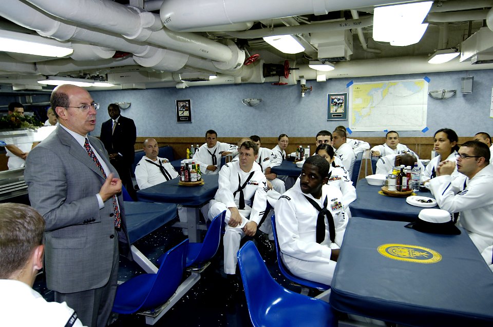 US Navy 060829-N-3642E-001 Secretary of the Navy (SECNAV), the Honorable Dr. Donald C. Winter talks with Sailors aboard the guided-missile cruise USS Shiloh (CG 67)