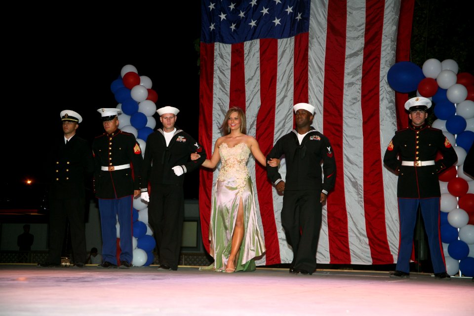US Navy 060907-N-3271W-009 Area Sailors and Marines take part in the Miss Utah State Fair Competition by escorting the ladies during the evening gown competition