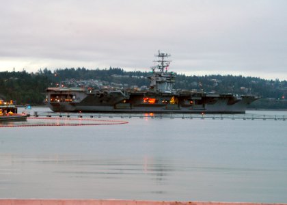 US Navy 060829-N-6247M-001 The Nimitz-class aircraft carrier USS Abraham Lincoln (CVN 72) departs Naval Station Everett, to begin a six-months post deployment dry dock maintenance period at Puget Sound Naval Shipyard, near Nava photo