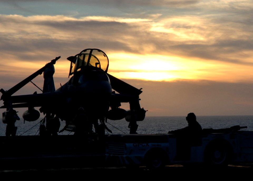 US Navy 061110-N-2659P-116 Sailors aboard the nuclear-powered aircraft carrier USS John C. Stennis (CVN 74) finish parking aircraft on the flight deck after a long day of flight operations