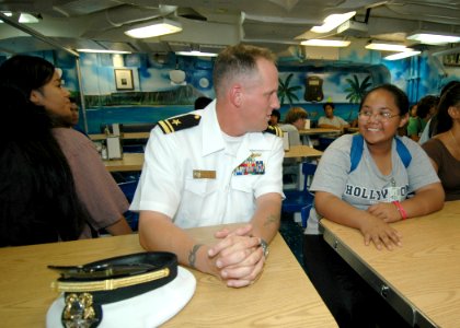 US Navy 061101-N-0879R-005 On the mess decks of the Pearl Harbor-based guided-missile destroyer USS Hopper (DDG 70), students from Aiea High School learn about the ship and the Navy's mission