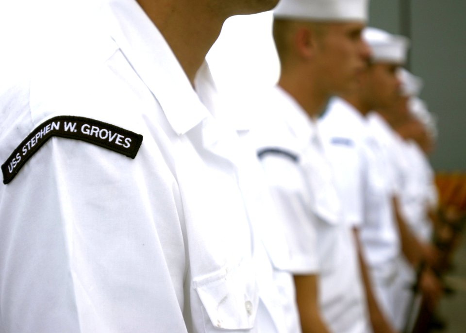 US Navy 061110-N-3285B-040 Sailors stationed aboard the Oliver Hazard Perry-class frigate USS Stephen W. Groves (FFG 29) participate in a burial at sea