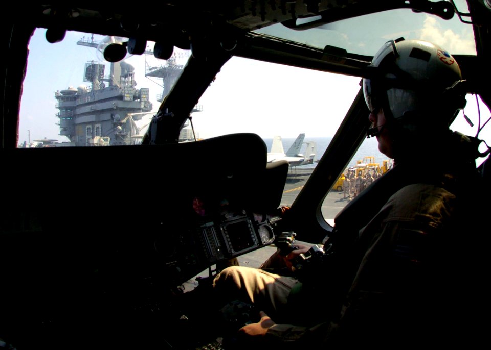 US Navy 061103-N-0490C-004 A pilot assigned to the Nightdippers of Helicopter Anti-submarine Squadron Five (HS-5), takes off from the flight deck of the Nimitz-class aircraft carrier USS Dwight D. Eisenhower (CVN 69)