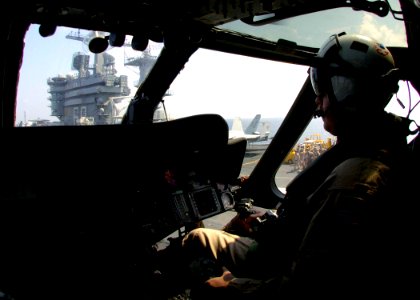 US Navy 061103-N-0490C-004 A pilot assigned to the Nightdippers of Helicopter Anti-submarine Squadron Five (HS-5), takes off from the flight deck of the Nimitz-class aircraft carrier USS Dwight D. Eisenhower (CVN 69)