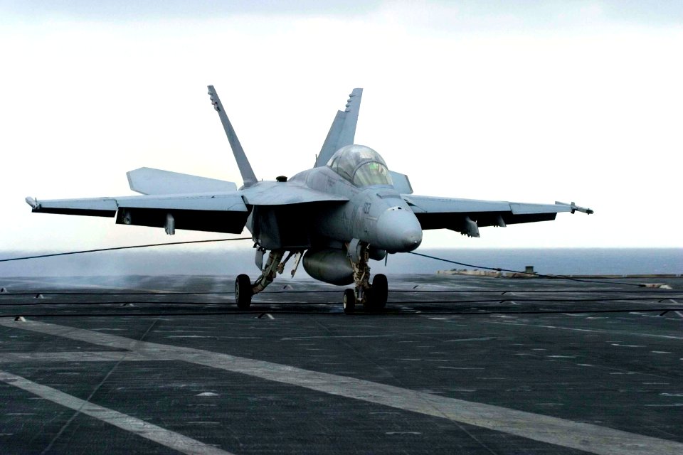 US Navy 061112-N-8591H-053 An F-A-18F Super Hornet assigned to Strike Fighter Squadron One Zero Two (VFA-102) lands on the flight deck of USS Kitty Hawk (CV 63)
