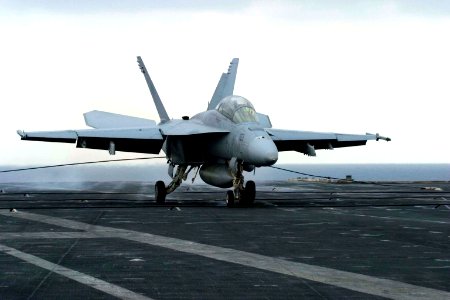 US Navy 061112-N-8591H-053 An F-A-18F Super Hornet assigned to Strike Fighter Squadron One Zero Two (VFA-102) lands on the flight deck of USS Kitty Hawk (CV 63)