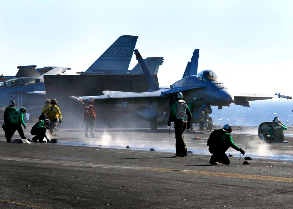 US Navy 061113-N-3729H-083 An F-A-18C Hornet from the Death Rattlers of Marine Fighter Attack Squadron Three Two Three (VMFA-323) prepares to launch from a steam driven catapult during flight operations aboard the nuclear-power