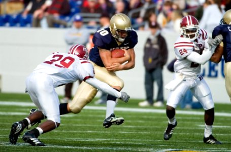 US Navy 061118-N-0696M-032 Naval Academy Midshipmen quarterback Kaipo-Noa Kaheaku-Enhadatake keeps the ball on the option versus the Temple University Owls at Navy-Marine Corps Memorial Stadium