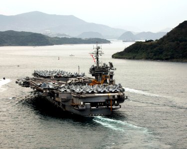 US Navy 061106-N-6106R-874 USS Kitty Hawk (CV 63) sails into the harbor of Sasebo during a scheduled port visit