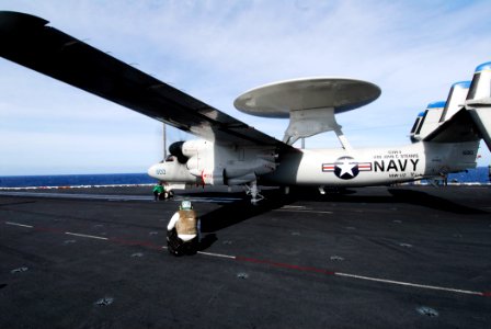 US Navy 061111-N-3729H-219 Sailors guide an E-2C Hawkeye assigned to Carrier Airborne Early Warning Squadron One One Two (VAW-112) to a steam driven catapult in preparation for launch from the flight deck of the nuclear-powered