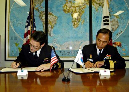 US Navy 061108-N-4649C-002 Commander, Submarine Group Seven Rear Adm. John Bird (left), and Commander, Korean Submarine Forces Rear Adm. Il Heon Bae, sign a Mutual Logistics Support Agreement photo