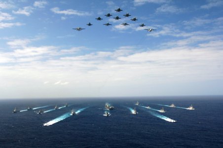 US Navy 061114-N-8591H-147 Aircraft assigned to Carrier Air Wing Five (CVW-5) fly over a group of 18 U.S. and Japanese Maritime Self-Defense Force ships, at the conclusion the two nations' exercise ANNUALEX