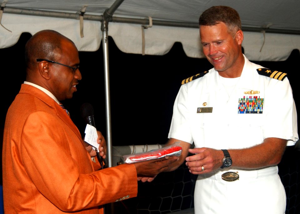 US Navy 061115-N-3285B-197 The commanding officer of the Oliver Hazard Perry-class frigate USS Stephen W. Groves (FFG 29) receives the newly introduced flag of the Caribbean Island of Sint Eustatius