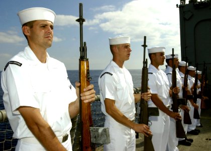 US Navy 061110-N-3285B-071 Sailors stationed aboard the Oliver Hazard Perry- class frigate USS Stephen W. Groves (FFG 29) participate in a burial at sea photo