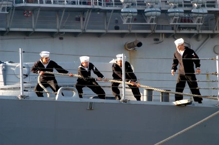 US Navy 061114-N-1713L-030 Sailors on board the guided-missile frigate USS Nicholas (FFG 47) heave a mooring line to secure the ship after arriving into their homeport at Naval Station Norfolk