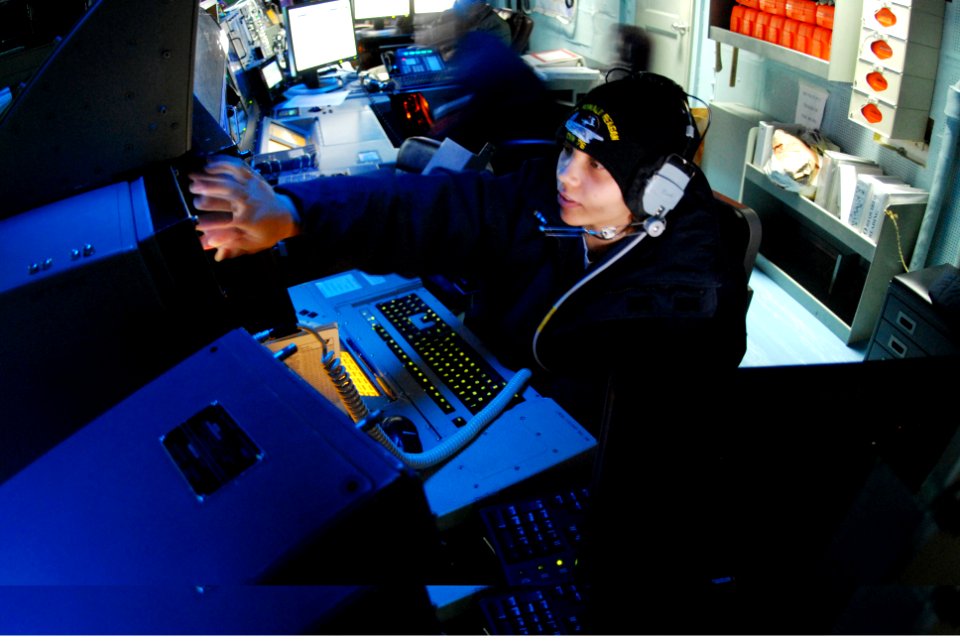 US Navy 061116-N-4776G-196 Operations Specialist 2nd Class Iesha Abram mans the tactical information coordinator watch in the Combat Direction Center aboard USS Ronald Reagan (CVN 76)