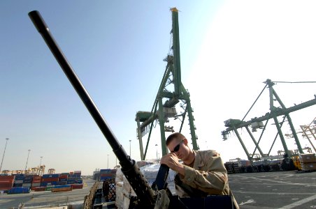 US Navy 061116-N-8148A-140 Gunner's Mate Seaman Randy Barnes, attached to Mobile Security Squadron Three (MSS-3), applies lubricant on a .50 caliber machine gun