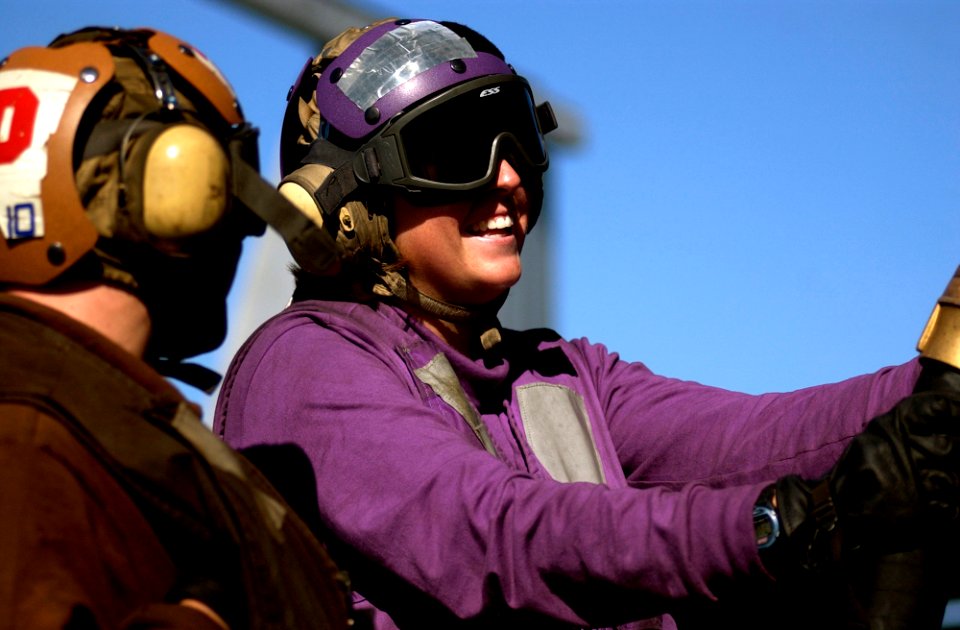 US Navy 061116-N-7130B-345 Plane captain and Aviation Boatswain's Mate Airman Elene Adler's aircraft is refueled on the flight deck of USS Ronald Reagan (CVN 76)